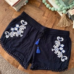 Dark blue cotton shorts with embroidered accents. Size small.